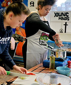 Young people at practical cooking class