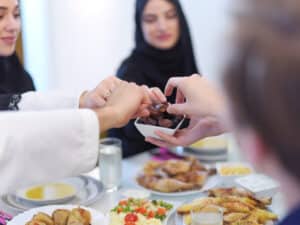 People sharing food around a table