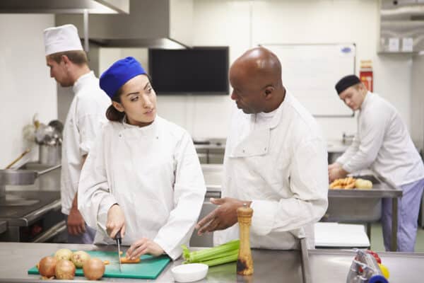 People cooking in a commercial kitchen